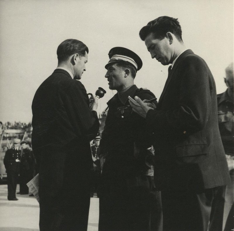 The commander of the Normandie-Niemen air regiment, Lt. Col. Louis Delfino, gives an interview. France. Paris, Le Bourget Airport, June 1945