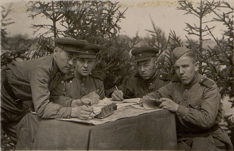 Image: Editorial board of the wall newspaper "Svyazist" (from left to right): Sergeant M. Lunev, (artist), Sergeant Major I. Kulichkin, company party organizer Senior Sergeant M. Shadrin and member of the editorial board Senior Sergeant V. Semyonov
