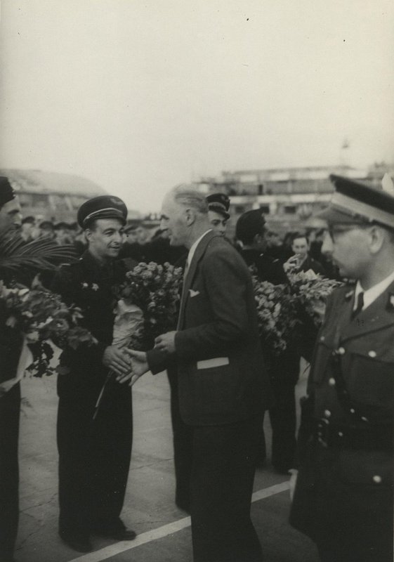 Minister of Aeronautics and Armaments Charles Tillon congratulates the pilots of the Normandie-Niemen Air Regimenton their arrival at home