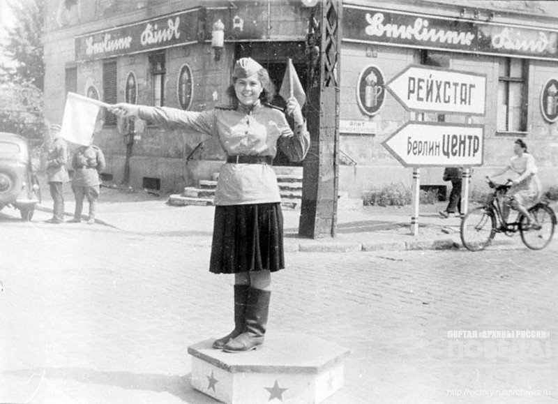 Soviet female traffic-controller at the streets intersection in Berlin