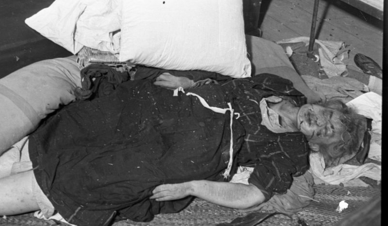 "Kalinin Front. In liberated Rzhev. The corpse of a murdered woman."