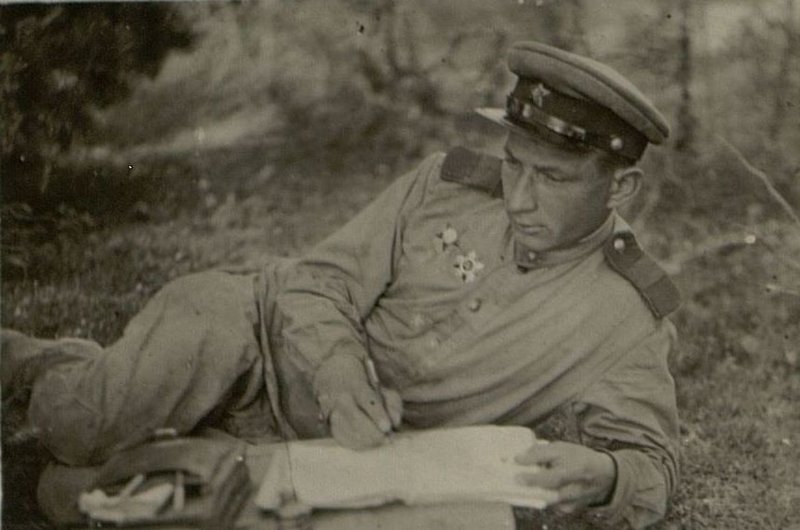 Image: Party organizer of the 1st battery, gun commander Senior Sergeant M. Kalashnikov prepares a report to the battery party meeting - on the tasks of the communists in the upcoming battles for the capture of the city and the fortress of Osovets.