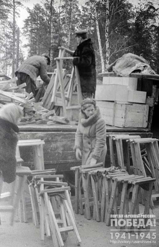 Loading of furniture for the officers' club, given as a gift by the workers of the Kuntsevskiy District, onto a truck