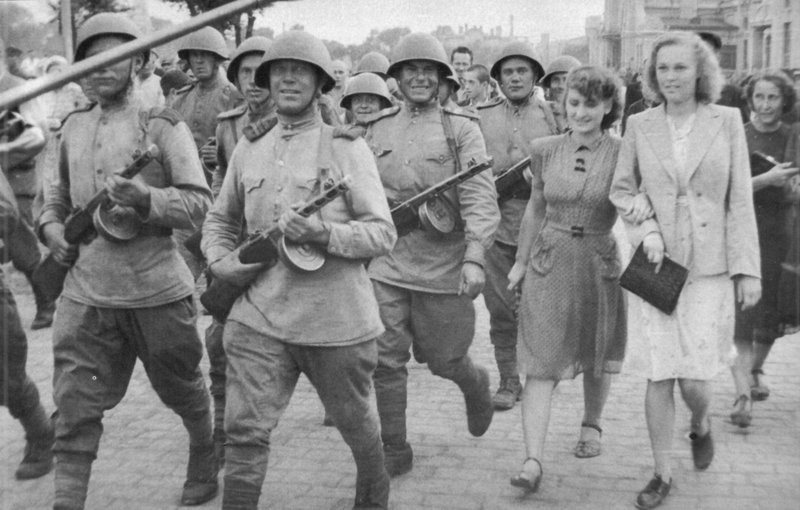 Soviet soldiers marching on a street of Harbin