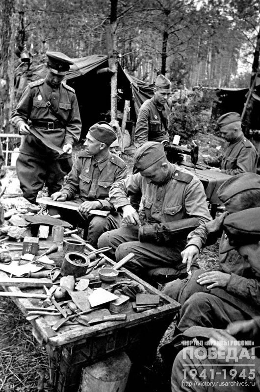 Soldiers at work in a field repair shop