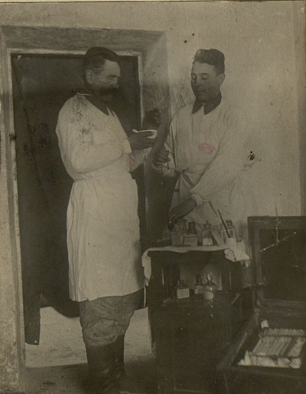 Image: The head of the regiment's pharmacy, military assistant Ivan Petrovich Chernykh, together with the foreman Comrade I.R. make up medicines for patients being treated in the regimental medical center.