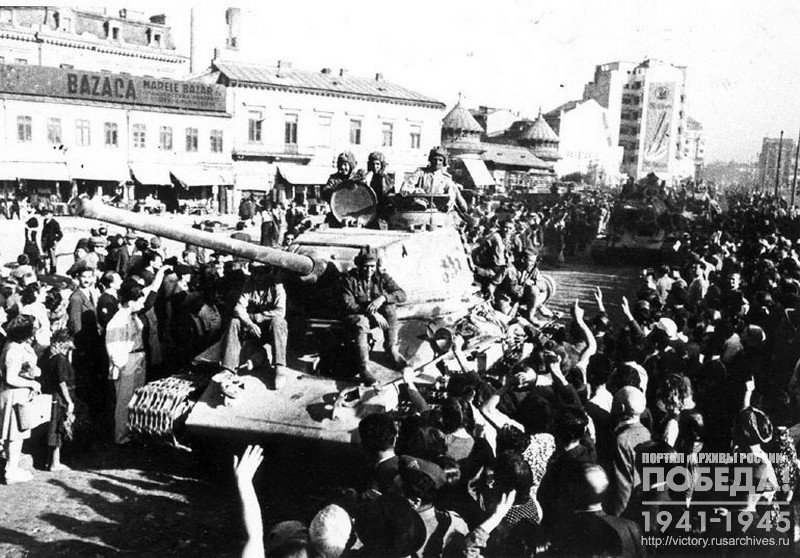 Residents of Bucharest welcome Soviet troops entering the city