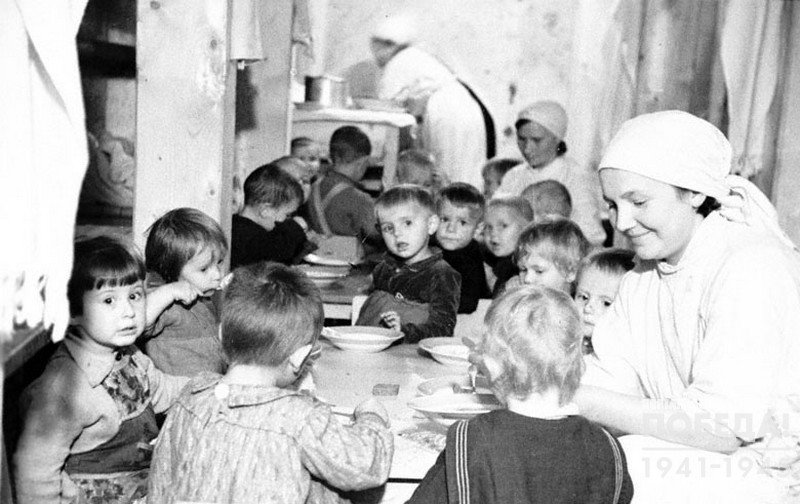 Children of the nurseries eating in a bomb shelter