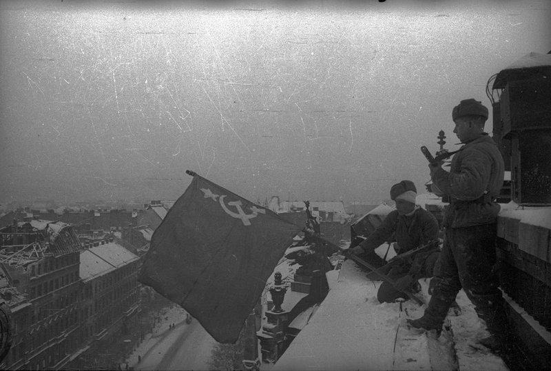 Soviet flag fluttering over Budapest on the roof of Parliament Building