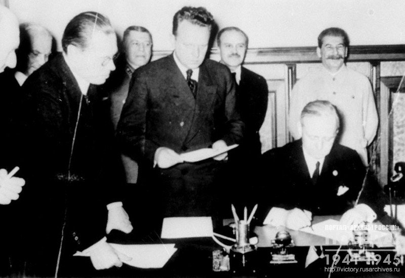 German Foreign Minister Joachim von Ribbentrop signing Non-Aggression German-Soviet Treaty. Among those present: Joseph Stalin, V. Molotov, B. Shaposhnikov and USSR Ambassador to Germany A. Shkvartsev