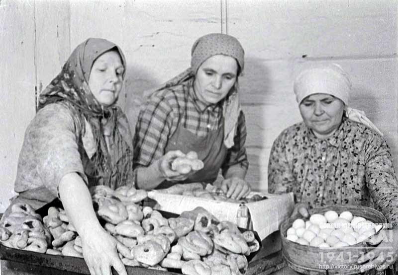 Members of collective farm Red Fighter pack food parcels to be sent to the front