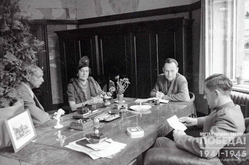 German lawyer Baare Fernade and his wife at a reception at the Military Commandant of the 3rd section of the Mitte District, Captain V. Shorin; 2nd from the right - translator