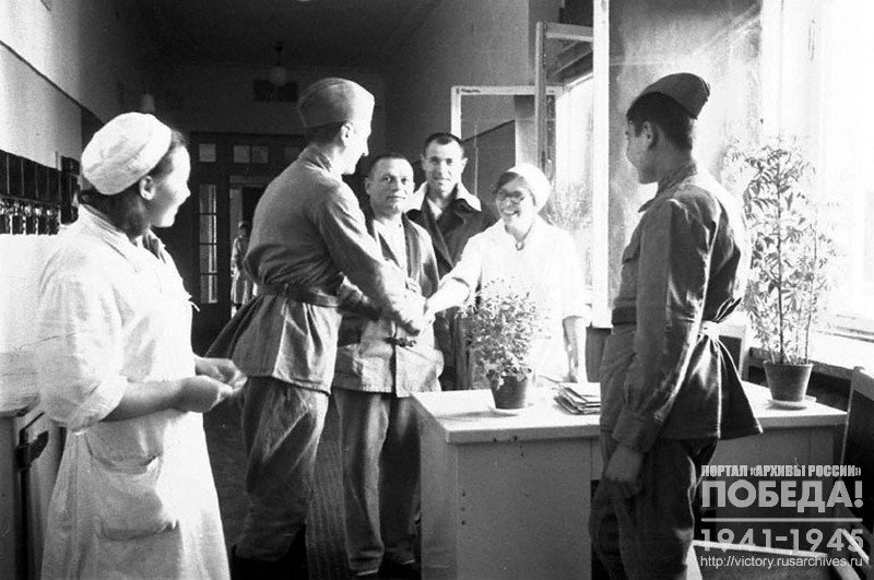 Wounded and recovered  soldiers after treatment at the clinic-hospital named after doctor Botkin, say goodbye to Doctor Malyutina V.N, left -  nurse Tarasova Z.N.