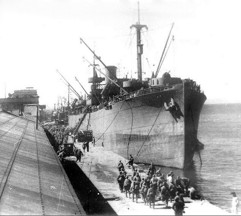 Transport ship Stalingrad disembarks troops in the Otomari seaport