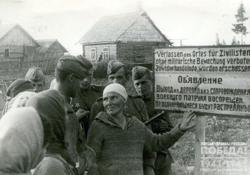 Village inhabitants near Opochki telling their liberators 2nd Baltic Front soldieries about  hard life in German captivity