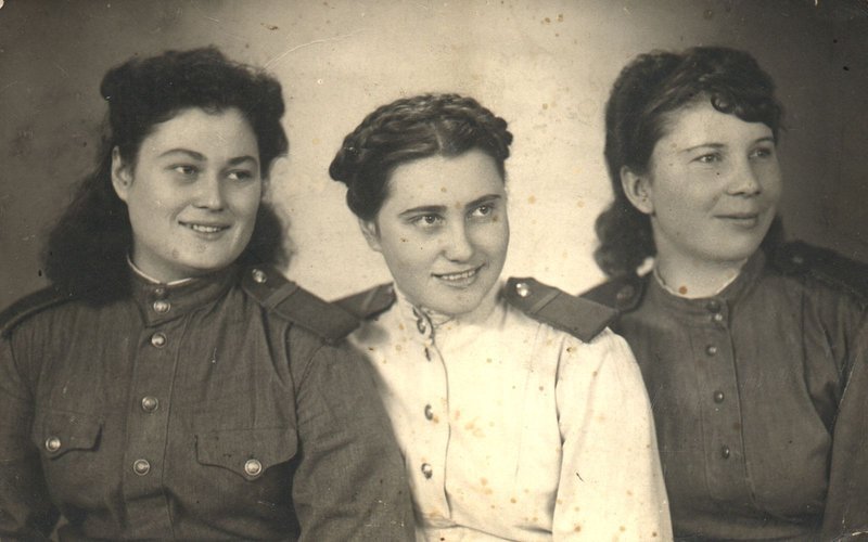 Komsomol organizer I.I. Klykova with a group of the sanitary members of public order squad.