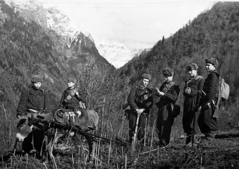 A group of Soviet anti-tank riflemen on the move in a North Caucasian mountain pass