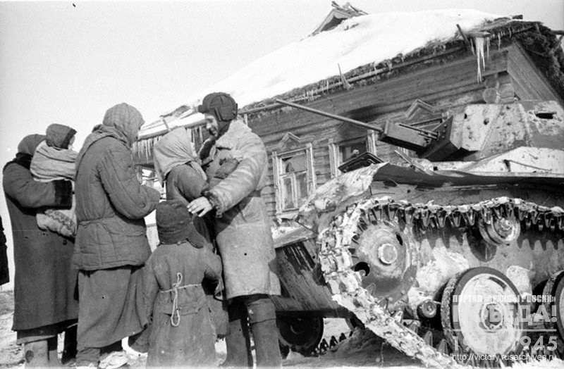 Women and children meet liberator soldiers