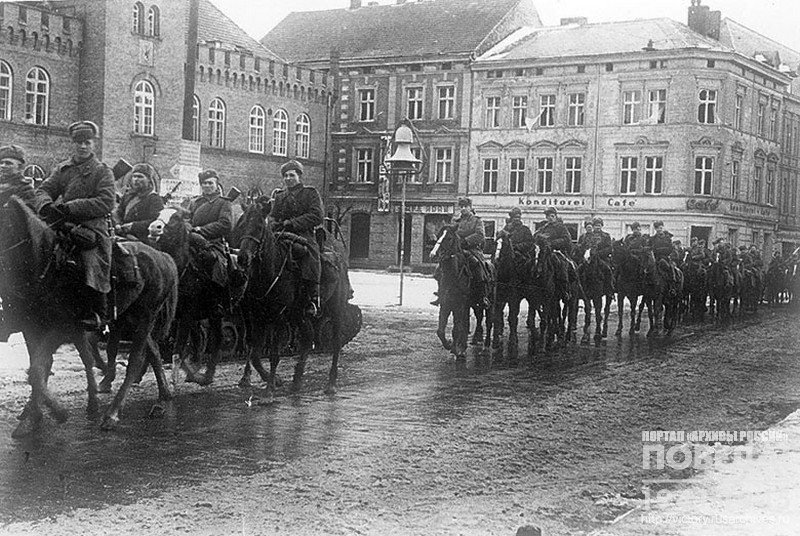 Troops of General Oslikovskiy's Guards Cavalry Corps enter the town of Neustettin
