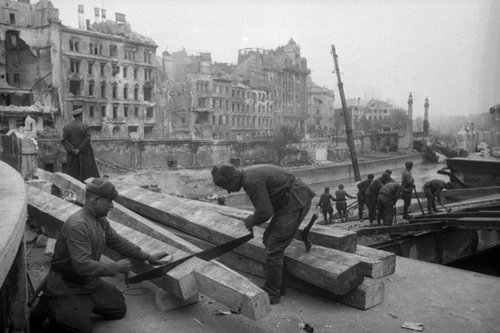 Soviet sappers work to restore the bridge over the canal in Vienna, blown up by the Nazis