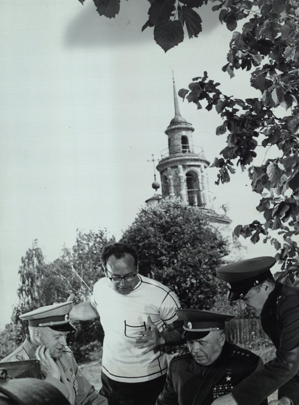Marshal of the Soviet Union K. Rokossovsky (left), General of Army A. Beloborodov, director-producer V. Ordynsky (standing in the center) during the filming of the movie "If your home is dear to you..."