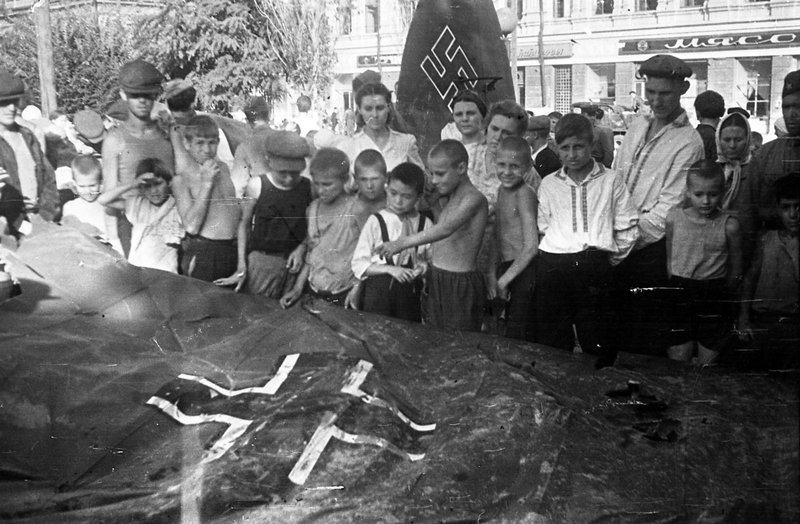 Stalingrad residents inspect the downed German plane displayed in the Central Park of the city