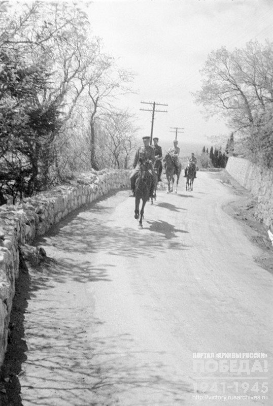 Mounted border guards patrol on the road near the town of Alupka. Crimea, 1944
