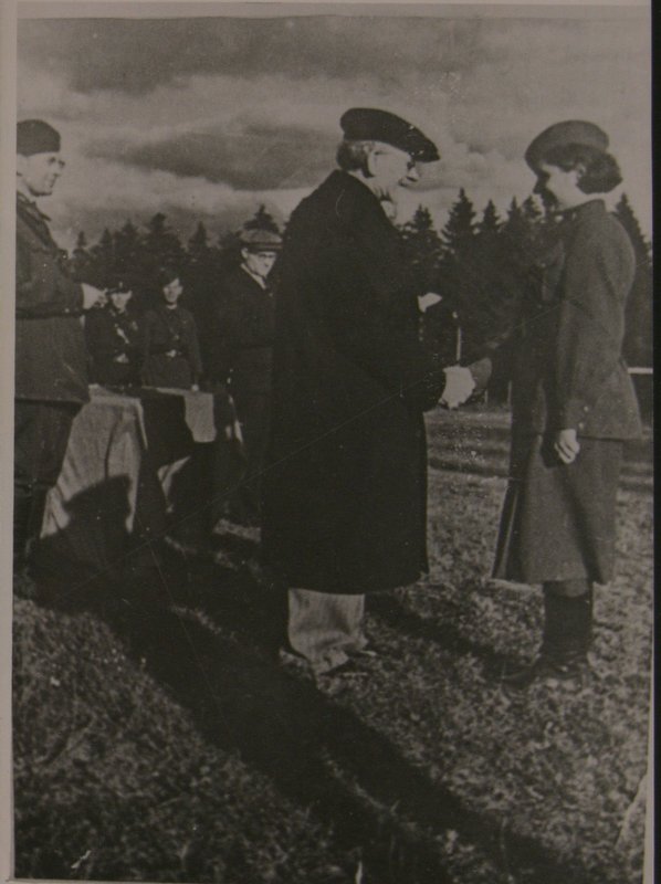 Chairman of VTsIK USSR M.I. Kalinin presents an award to politruk I.I. Antipenko. 1943
