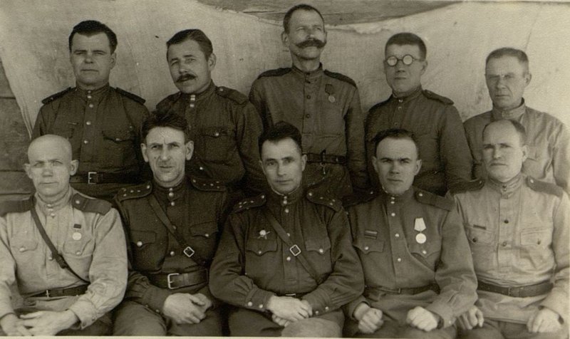 Image: The agitator of the regiment, Captain Comrade Melnichuk, with the party organizers of the grassroots organizations