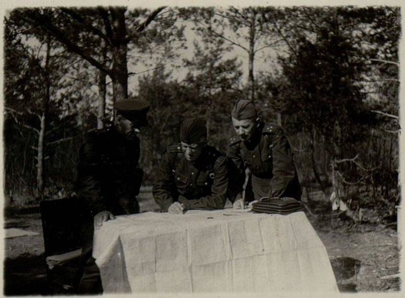 Image: Major Solnyshkov, Captain Perov and Senior Lieutenant Skvartsov familiarize themselves with the combat situation