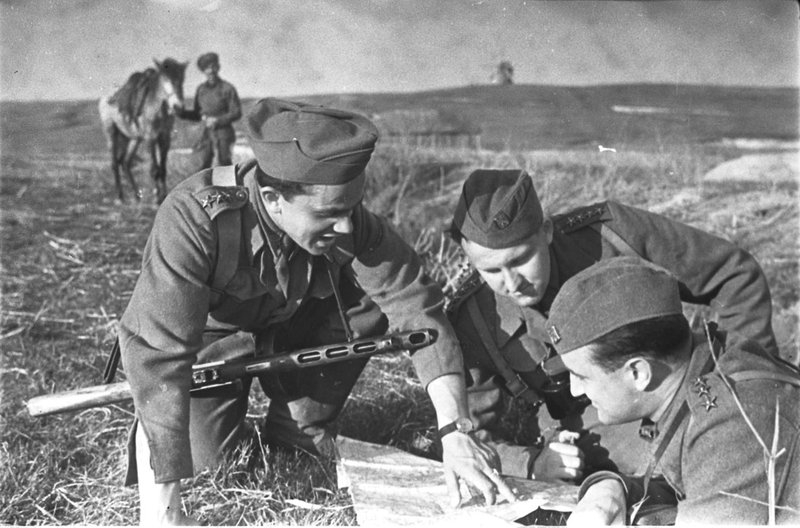 Officers and soldier of the Czechoslovak Вrigade at the captured motorcycle (Ukraine)