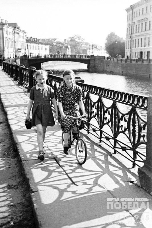 Girls walking along the embankment