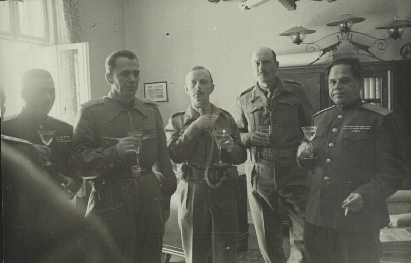 Link-up on the Elbe. Representatives of the command of 2nd Belorussian Front and the British command propose a toast for the Victory. 