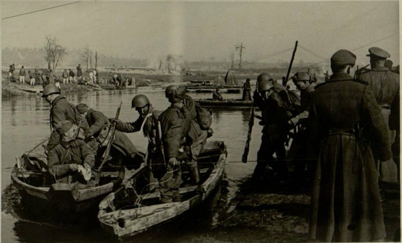 Image: By boats across the river