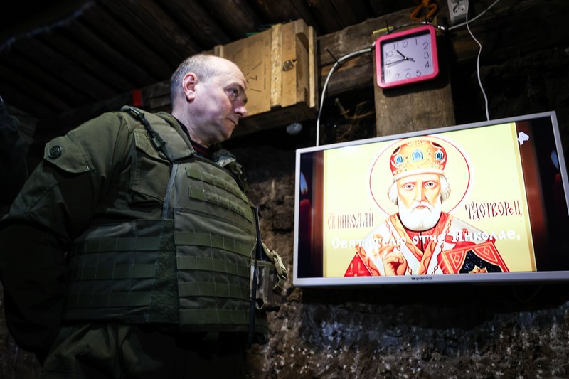 Operation of volunteer battalion named after Andrew the First-called in Zaporozhye region. Russia. Zaporozhye region. Serviceman in dugout before Orthodox Easter celebrations