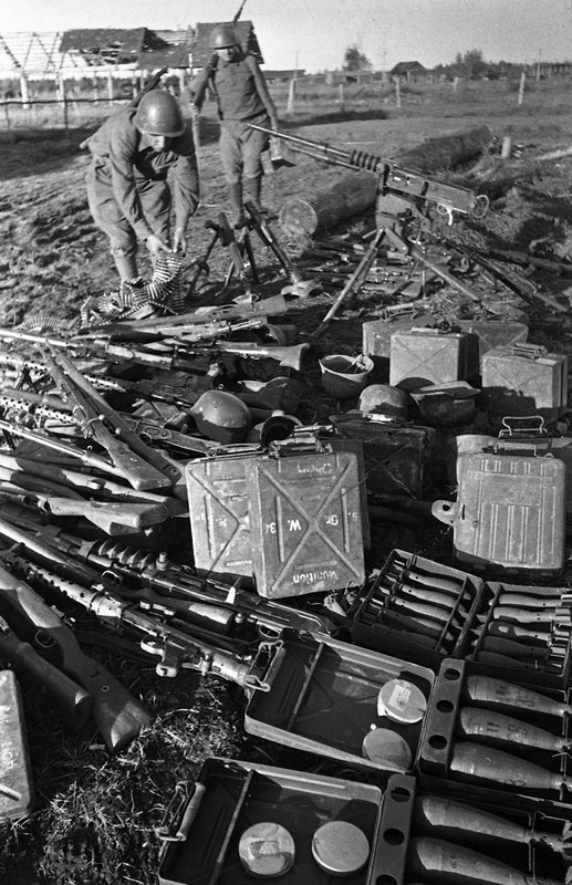 Soviet soldiers pile up trophies captured from the enemy near Rzhev.