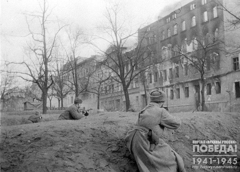 Submachine gunners of the unit of Captain G. Bolshakov conduct a street fight in one of the towns of Pomerania