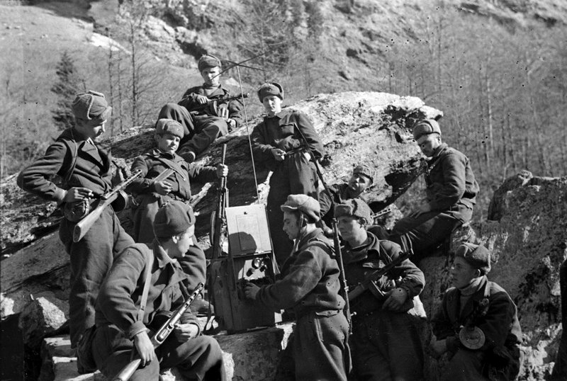 Red Army soldiers defending the Caucasian passes listen to a Moscow radio broadcast