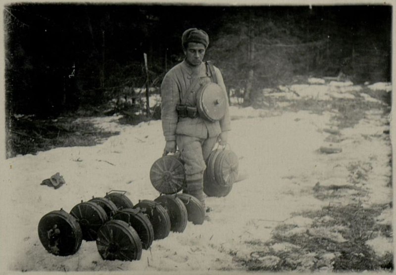Image: Lance corporal Shuvalov brings defused German mines to the warehouse