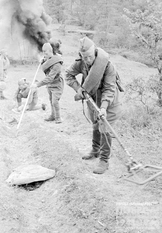 Bomb disposal squad clearing a mountain road from the mines