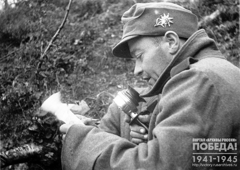 Captured German soldier of the 12th company of the 137th Mountain Jaeger Regiment E. Centron speaks on the radio to his compatriots with a call to throw down their weapons and go over to the Red Army side