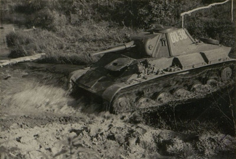 Image: At the exercises. Tank T-70 overcomes the water line
