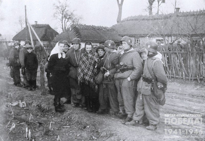 Galician volunteers are talking to the locals in one of the villages