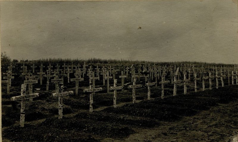 Image: The corpses of Germans killed by shell fragments and a German cemetery in the village of Maslovo. Most of the crosses in the cemetery have inscriptions dated 5.7 and 6.7.43.