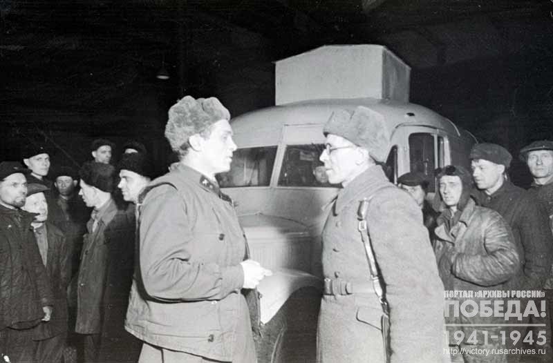 Representative of the workers of the “Ilyich” Western Railroad Depot during the transfer of the truck-bath to the representative of the Red Army Command