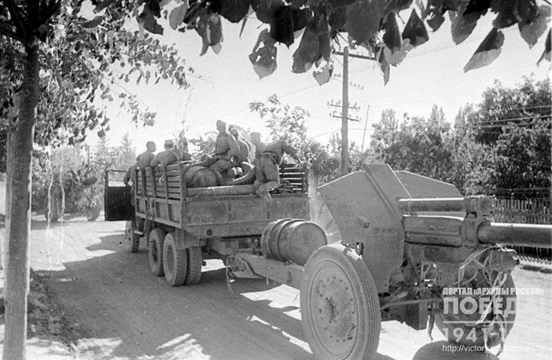 Soviet artillery crews passing through one of the streets of Ploeshti on the day of its liberation