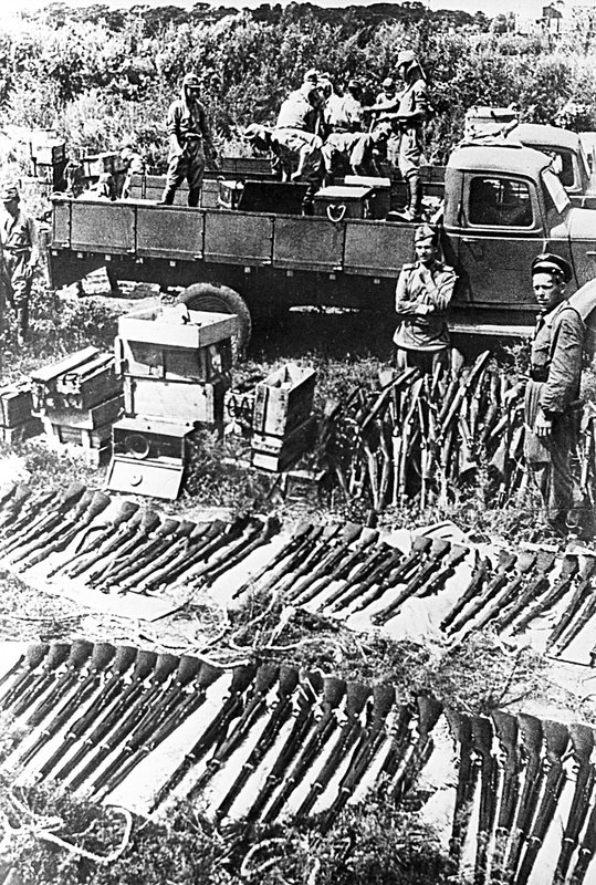 Japanese soldiers surrendering their arms and ammunition after capitulation of Japanese army. Manchuria