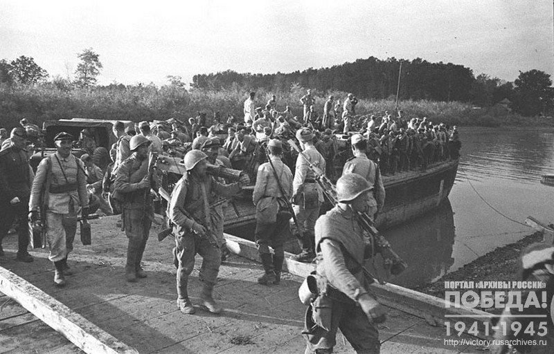 Red Army soldiers disembarking   from the barge delivered them to the territory of Yugoslavia