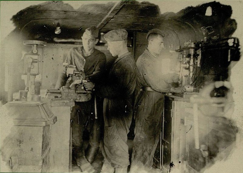 Image: Work in the assembly shop Senior Sergeant  Dobrynin, Red Army soldier Levi and Red Army soldier Burakov