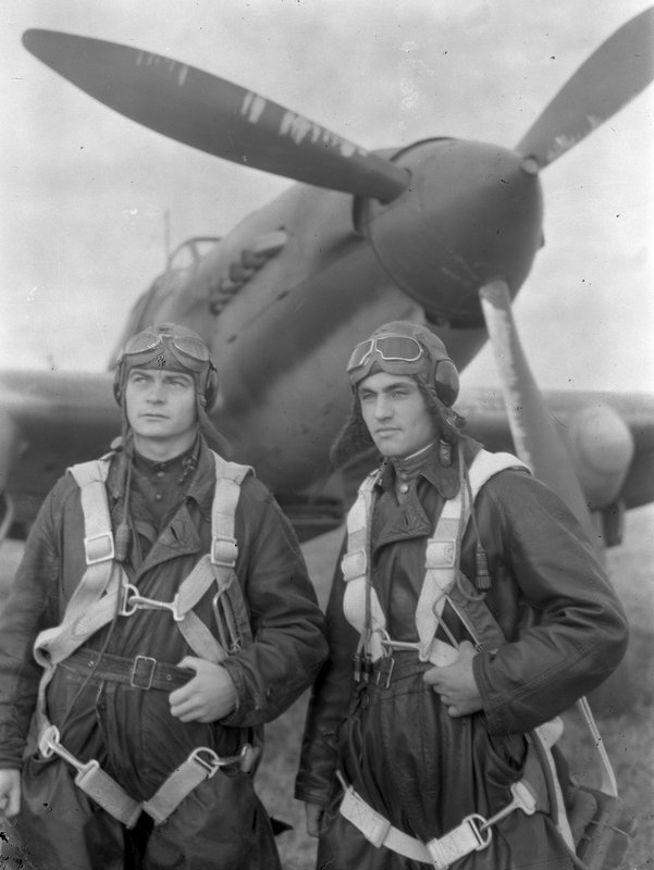 Pilots of a 571st strike aviation regiment Captain M.S. Bykov and air-gunner staff sergeant A.S.Ryizhikh near a plane